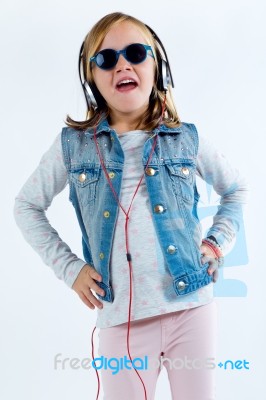 Beautiful Child Listening To Music With Digital Tablet Stock Photo