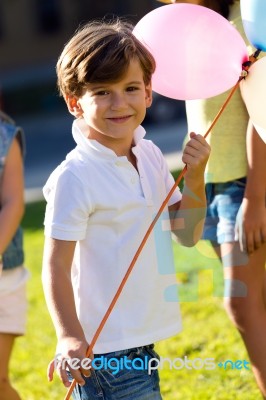 Beautiful Children Having Fun In The Park Stock Photo