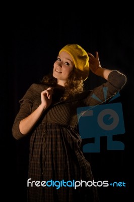 Beautiful, Fashionable, Glamorous, Nice, Attractive,pretty,nice,cheerful,smiling,parisian Girl,woman,student,teenager,lady With Cite Smile,face,well-dressed And Yellow Beret,cap,gesture,pose,posing.portrait.black Background.photo Studio.paris,manners Stock Photo