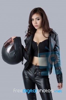 Beautiful Female Biker Wearing A Leather Jacket Stock Photo