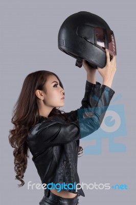 Beautiful Female Biker Wearing A Leather Jacket Stock Photo