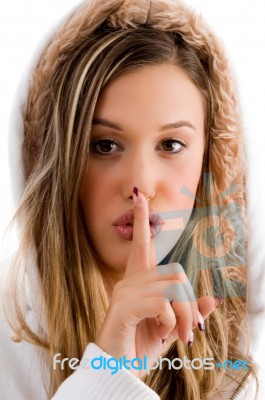 Beautiful Female Shushing With Finger Stock Photo