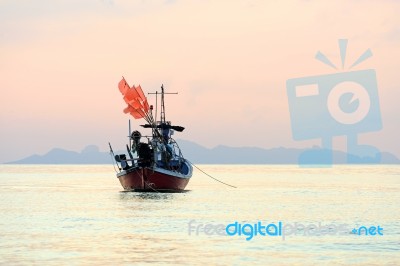 Beautiful Fishing Boat Floating With Golden Sunrise Light Backgr… Stock Photo