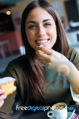 Beautiful Girl Drinking Coffee Sitting Indoor In Urban Cafe Stock Photo