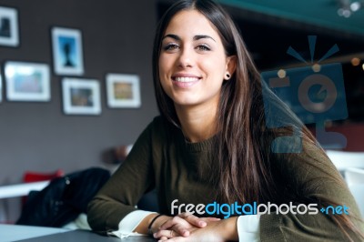 Beautiful Girl Drinking Coffee Sitting Indoor In Urban Cafe Stock Photo