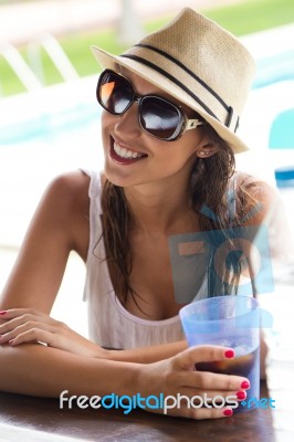 Beautiful Girl Drinking In The Pool Bar Stock Photo