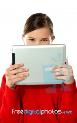 Beautiful Girl Hiding Her Face With Touch Pad Stock Photo