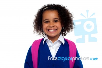 Beautiful Girl In Uniform With Backpack Smiling At You Stock Photo