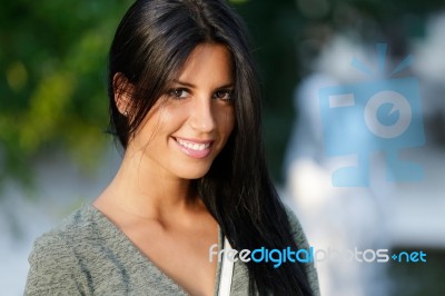 Beautiful Girl Posing At Camera In The Park Stock Photo