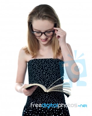 Beautiful Girl reading Book Stock Photo