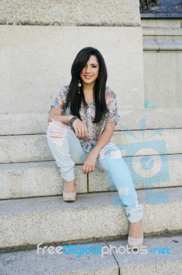 Beautiful Girl Sitting On Stairs  Stock Photo