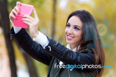 Beautiful Girl Taking A Selfie In Autumn Stock Photo