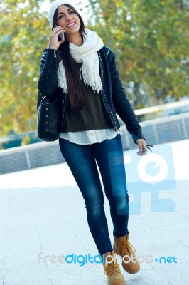 Beautiful Girl Using Her Mobile Phone In City Stock Photo