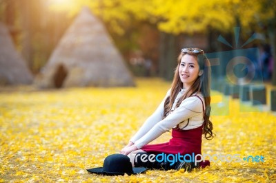 Beautiful Girl With Yellow Leaves In Nami Island, Korea. Nami Island In Autumn Stock Photo