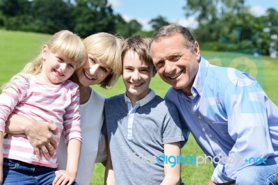 Beautiful Happy Family Enjoying At The Park Stock Photo