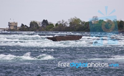 Beautiful Image With A Broken Boat On The River Right Before The Amazing Niagara Falls Stock Photo