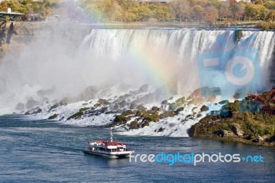 Beautiful Image With Amazing Niagara Waterfall, Rainbow, And A Ship Stock Photo