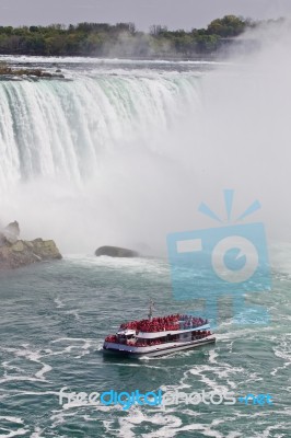 Beautiful Isolated Photo Of A Ship Near Amazing Niagara Waterfall Stock Photo