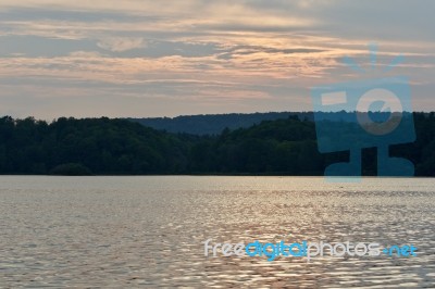 Beautiful Isolated Photo With The Lake And The Forest On The Sunset Stock Photo