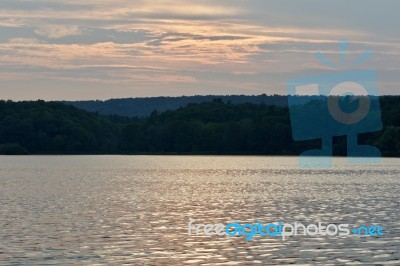 Beautiful Isolated Picture With The Lake And The Forest On The Sunset Stock Photo