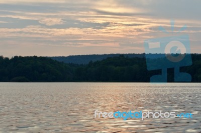 Beautiful Isolated Picture With The Lake And The Forest On The Sunset Stock Photo