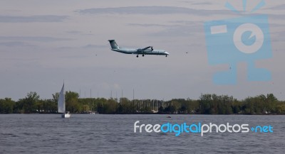 Beautiful Landing Of The Plane Near The Lake Stock Photo