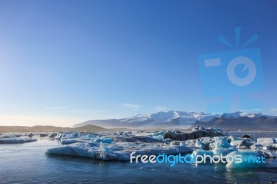 Beautiful Landscape Of Iceberg With Mountains Background Stock Photo