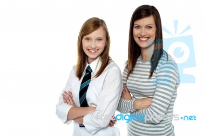 Beautiful Mom And Daughter Posing With Confidence Stock Photo