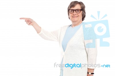 Beautiful Old Lady Pointing Away Stock Photo