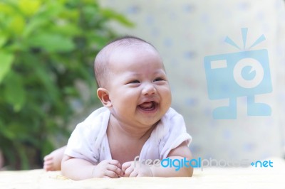 Beautiful Photo Close Up Face Of Adorable New Born Baby Smiling Stock Photo