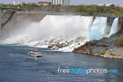 Beautiful Photo Of The Amazing Niagara Waterfall And A Ship At The Us Side Stock Photo