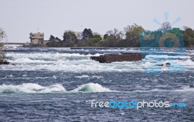 Beautiful Picture With A Broken Boat On The River Right Before The Amazing Niagara Falls Stock Photo