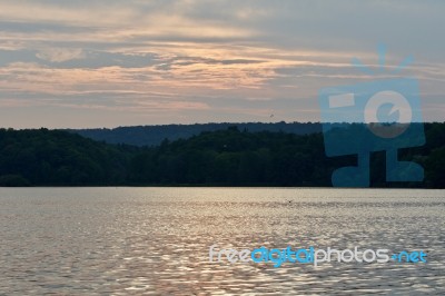 Beautiful Picture With The Lake And The Forest On The Sunset Stock Photo