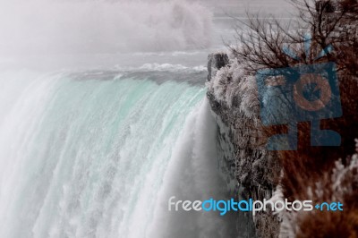 Beautiful Picture With The Niagara Waterfall And The Icy Shore Stock Photo