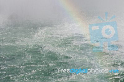 Beautiful Picture With The Water Near Amazing Niagara Falls With A Rainbow Stock Photo