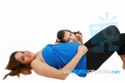 Beautiful Pregnant Woman And Her Daughter Stock Photo