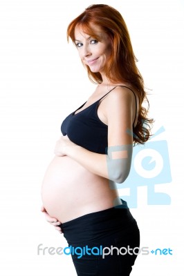 Beautiful Pregnant Woman Relaxing At Home Stock Photo