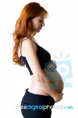 Beautiful Pregnant Woman Relaxing At Home Stock Photo