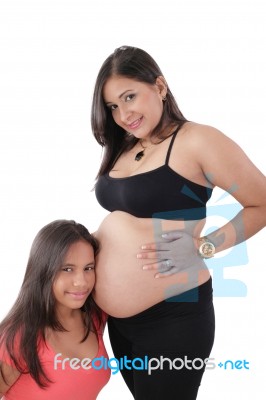 Beautiful Pregnant Woman With Her Daughter Stock Photo