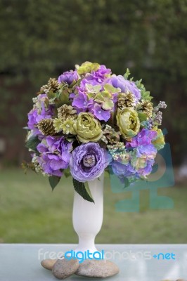 Beautiful Purple Flower Vase In The Garden Stock Photo