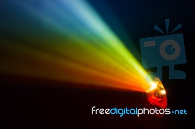 Beautiful Rainbow Color Wide Lens Projector With Light Beam For Movie And Cinema At Night . Smoke Texture Spotlight . Screening For Multimedia . Black Background  Stock Photo