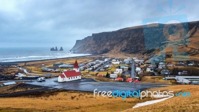 Beautiful Red Church And Vik Village, Iceland Stock Photo