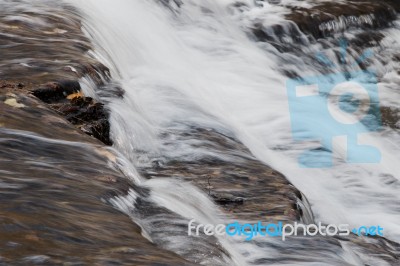 Beautiful Small Waterfalls Of A Fast Creek Stock Photo