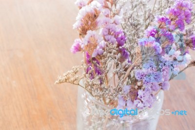 Beautiful Statice Flower Bouquet On Wooden Table Stock Photo