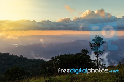 Beautiful Sun Rise On Top Mountain With Sun Ray Warm Tone Stock Photo