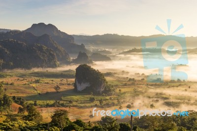 Beautiful Sun Rise Phulangka Mountain And The Mist Stock Photo