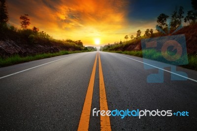 Beautiful Sun Rising Sky With Asphalt Highways Road In Rural Sce… Stock Photo