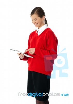 Beautiful Teenage Using Electronic Tablet Stock Photo