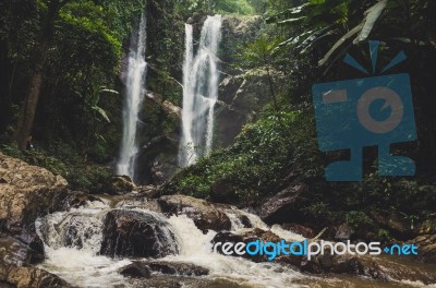 Beautiful Waterfall In Green Forest In Jungle Stock Photo