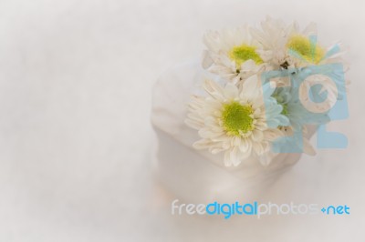 Beautiful White Mable Table With Flower Stock Photo